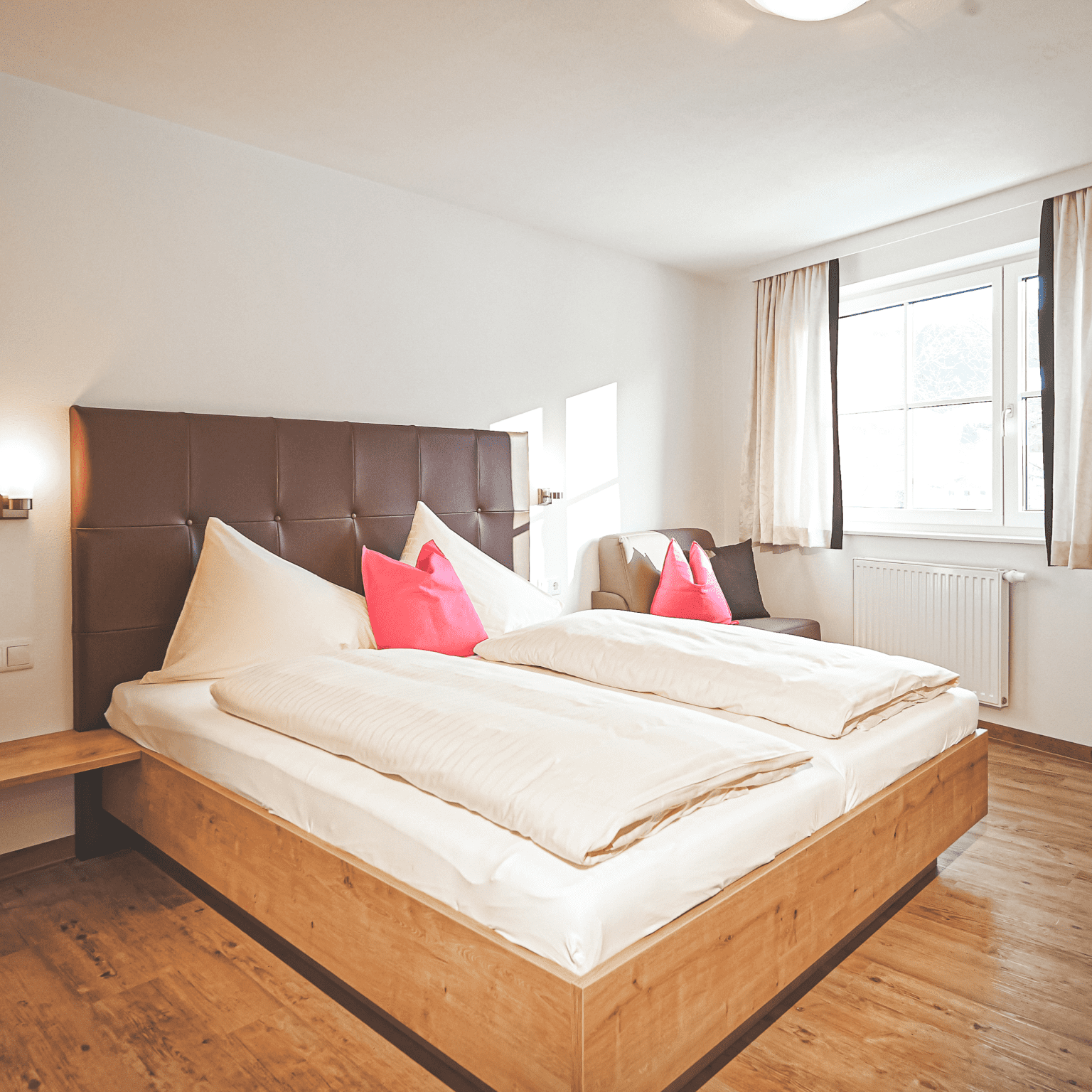 Schlafzimmer in den Ferienwohnungen Alpine Active, Flachau